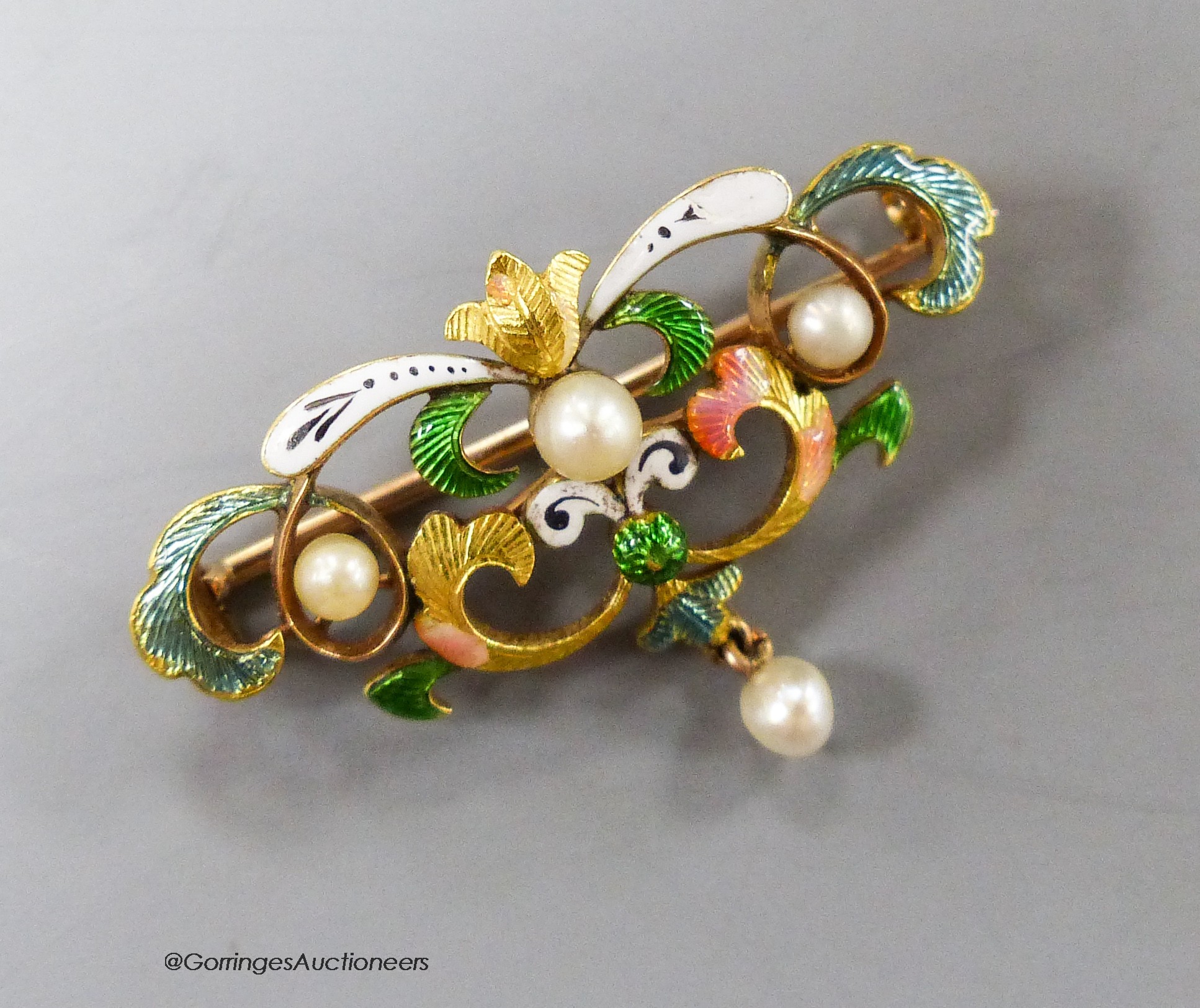 An early 20th century yellow metal enamel and seed pearl set drop brooch, 33mm, gross 5 grams (enamel a.f.).